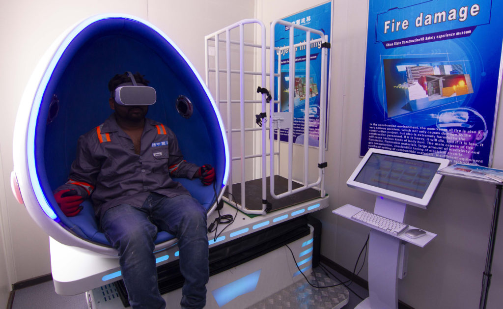 Construction workers experience simulated hazard management training in the Virtual Reality Pods at DAMACs AYKON City.