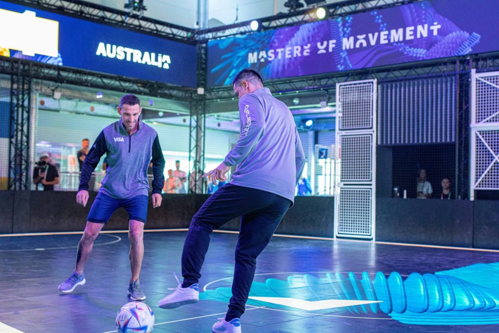 Tim Cahill and Maxi Rodriguez playing on the interactive Visa pitch scaled